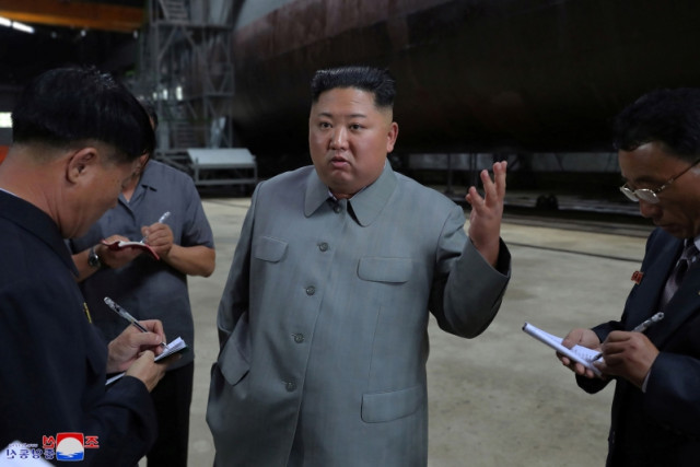 DPRK's Kim Jong Un inspects newly built submarine  