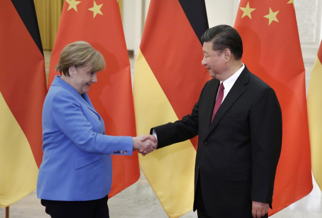 Merkel in Beijing says Hong Kong freedoms must be 'guaranteed'