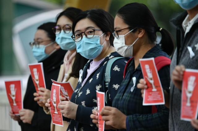 Hong Kong medics strike for China border closure over virus fears