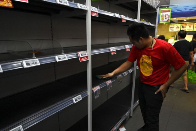 Panic buying hits Singapore after virus alert raised