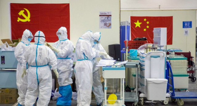 China virus cases drop as foreign fears rise