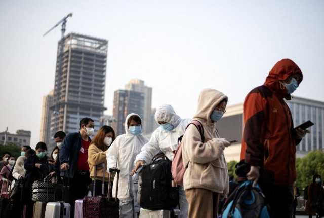 Wuhan exodus sparks virus hope despite mounting death toll