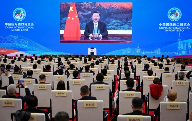 Xi touts China's huge economy as base of free trade in APEC speech