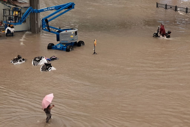 12 dead in flooded subway as downpours hit central China
