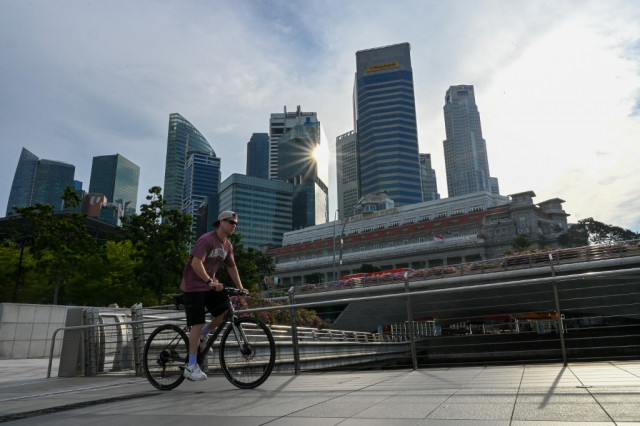Singapore tightens monetary policy as virus-hit economy recovers